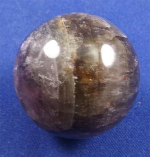 is a unique combination of two distinct types of quartz: Amethyst and Smoky Quartz.